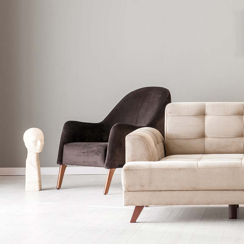 Luxurious brown leather upholstery on a contemporary sectional sofa along with a white sofa, showcasing clean lines and elegant stitching done by CA’s Drapery and Upholstery team